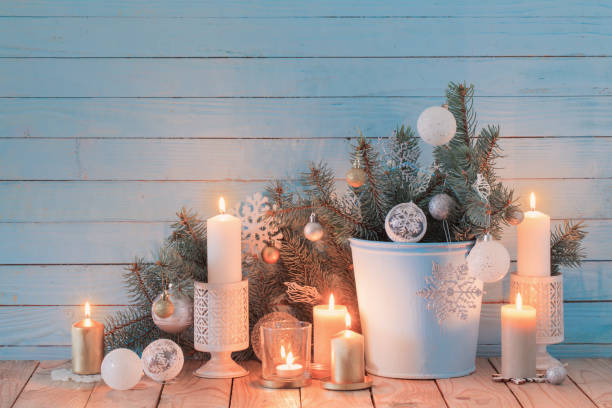 istock white Christmas decorations on blue wooden background 1192383739