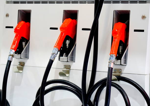 istock Petrol pump filling nozzles 1192384342