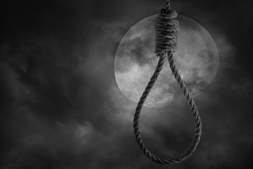 Rope noose for hanging men with scary full moon and clouds bright and dark at midnight