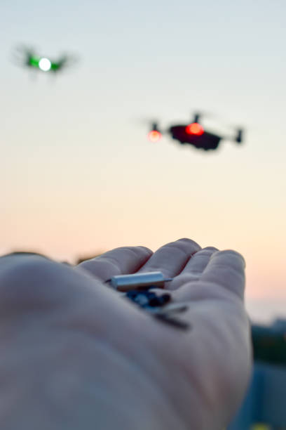 istock A man is going to feed the drone. The future has come. Drones bait 1192387746