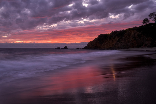 The colors of sunset linger for a long time after the sun actuatlly went down at Crescent Bay, Laguna Beach located in Orange County in Southern California