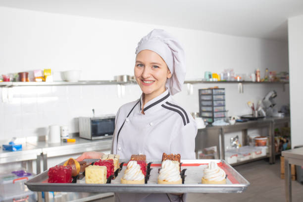 professional female chef and cakes