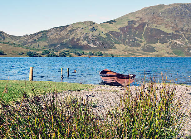 istock rowing boat and mountain scenic lake district cumbria 119239480