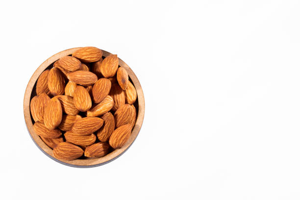 istock Peeled almonds - Prunus dulcis. White background 1192395008