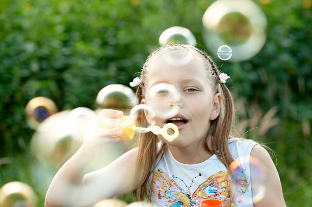 istock Little Girl blowing bubbles 119239825