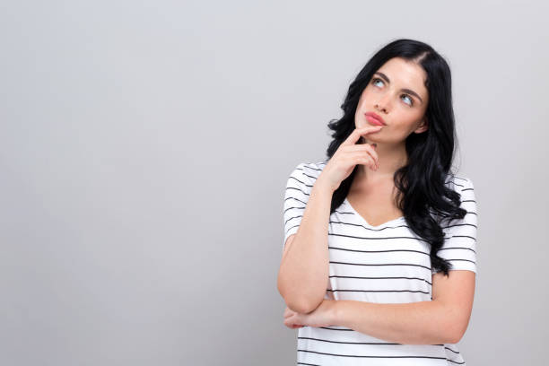 istock Young woman in a thoughtful pose 1192398622