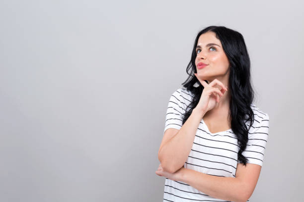 istock Young woman in a thoughtful pose 1192398628