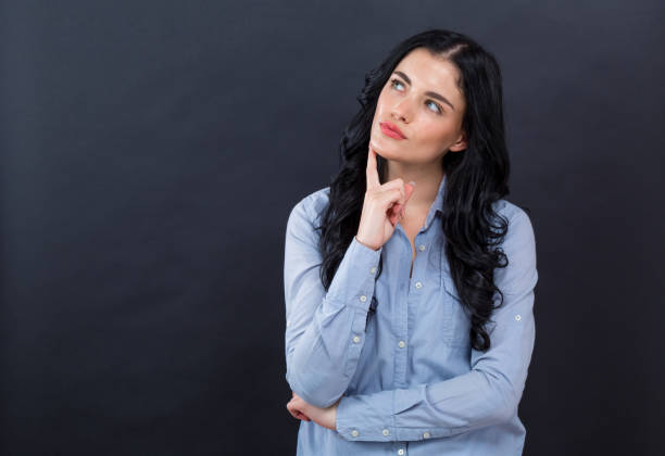 istock Young woman in a thoughtful pose 1192398632