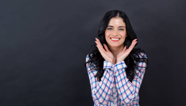 istock Surprised young woman posing 1192398638