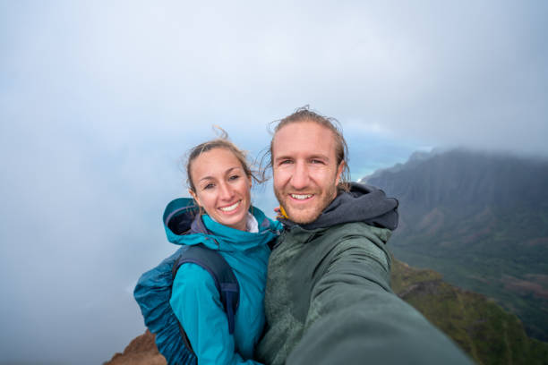istock Couple hiking in Hawaii taking selfie 1192417154