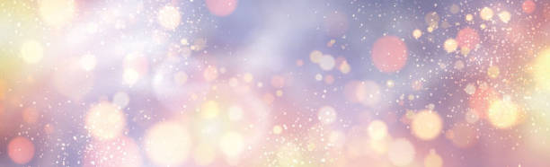 istock Christmas and New Year card with defocused ligths on silver. 1192421983