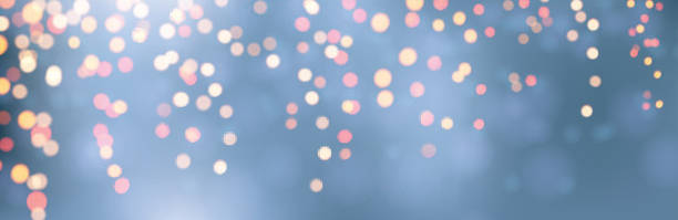 istock Christmas and New Year card with orange defocused ligths on blue. 1192421992