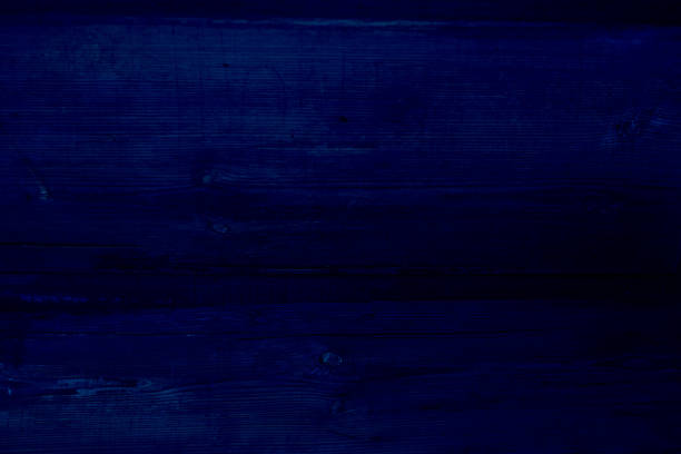 istock Walnut wood texture. Classic, blue monochrome, trend 2020. Duotone 1192424555