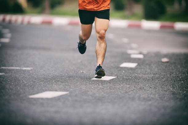 istock Group of people running race marathon 1192425470