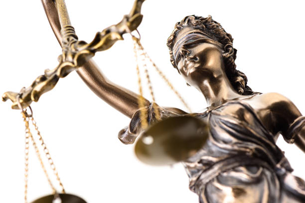 istock Statue of justice isolated on white background 1192425629