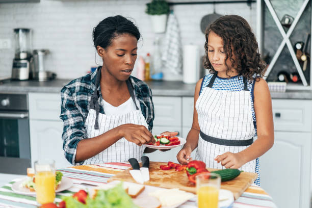 istock Mother and daughter in the kitchen 1192427428