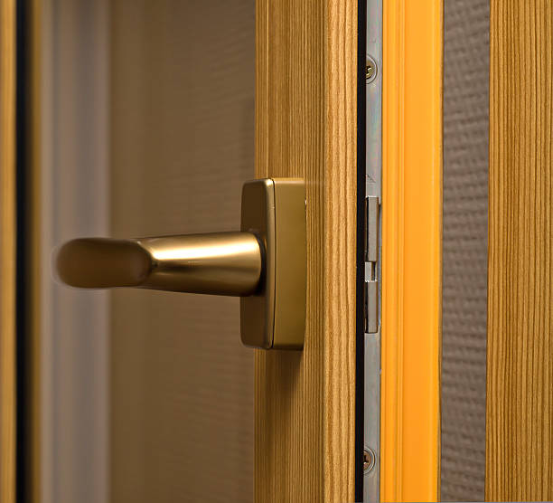 istock Window handle on fiberglass frame. Gold color. 119242794