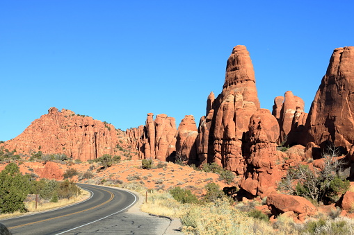 The national park road runs through some rugged desert landscape and natural beauty of sandstone rock formations
