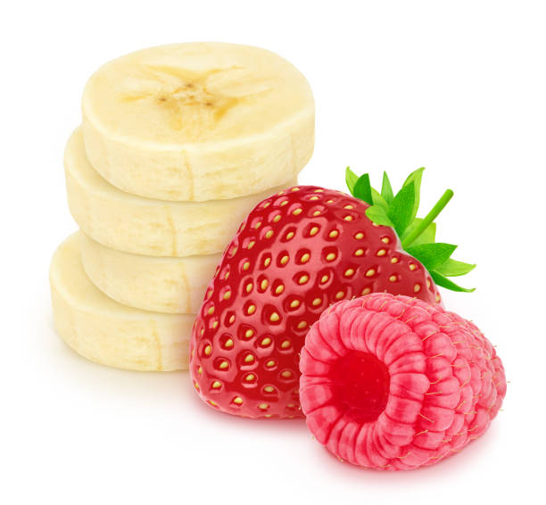 istock Composite image with garden berries and cutted banana isolated on a white background. 1192432348