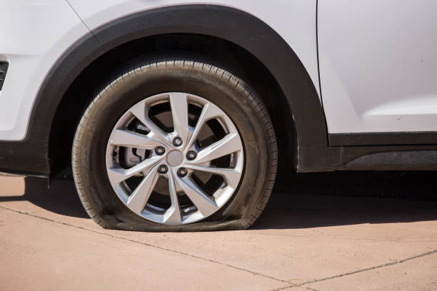 Flat Tire Straight on view of a flat tire. flat tire stock pictures, royalty-free photos & images