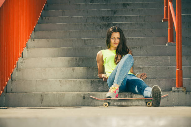 istock Girl on stairs with skateboard. 1192435756