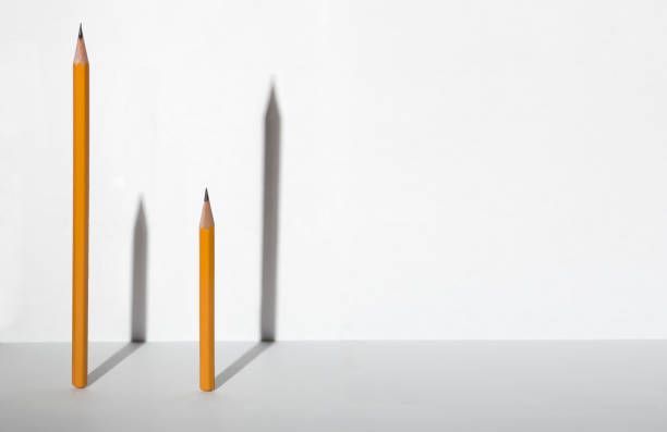 Graphite wooden pencil drawing dark gray or black line and big black mottled dot at white paper on left side. Tip is not sharp and picture can represent angry user with lost of nerves.