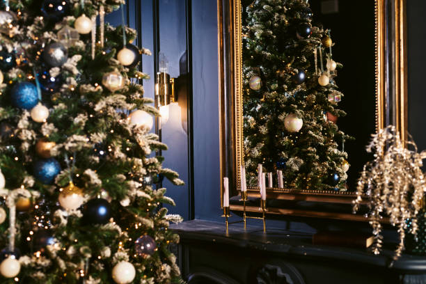 istock Christmas Tree and Christmas gift boxes in the interior with a fireplace 1192439664