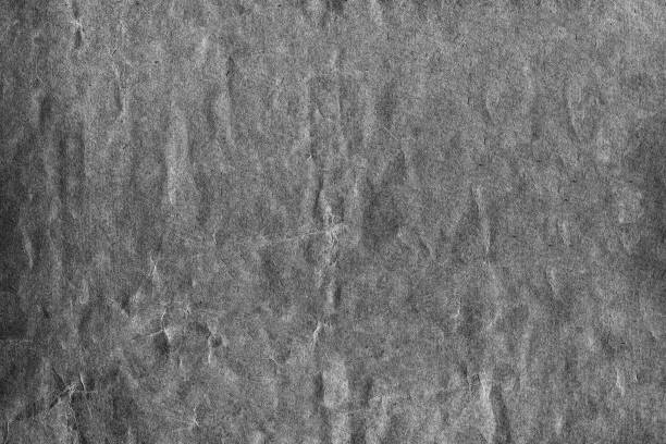 istock Strongly crumpled black white paper with strongly deformed surface 1192441502