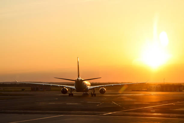 istock the plane standing on the side runway 1192441938