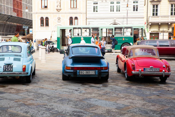 Old Fiat cars like 500 and Porche car exposed at the National Day of the Vintage Vehicle, Trieste TRIESTE, ITALY - OCTOBER, 01: Old Fiat cars like 500 and Porche car exposed at the National Day of the Vintage Vehicle on October 01, 2019 fiat 500 topolino stock pictures, royalty-free photos & images