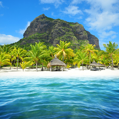Beautiful sandy beach with Le Morne Brabant mountain on the south of Mauritius island. Tropical landscape.