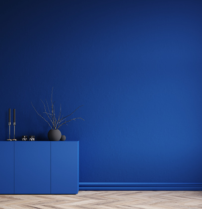 Minimal decorated dark deep blue room with chest of drawers and vase with branch, 3d render