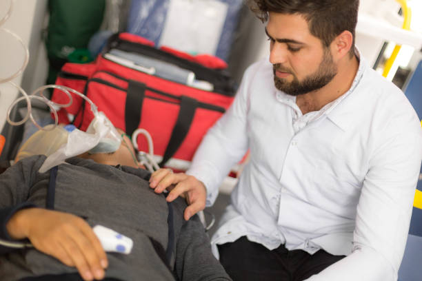 istock Emergency service paramedic rescuing a man 1192450617