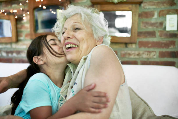 istock Affectionate Young Granddaughter with Smiling Grandmother 1192450756