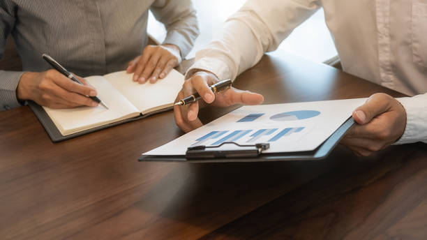 istock Business team brainstorming and discussing with financial data and report graph. Teamwork meeting working concept. 1192451930
