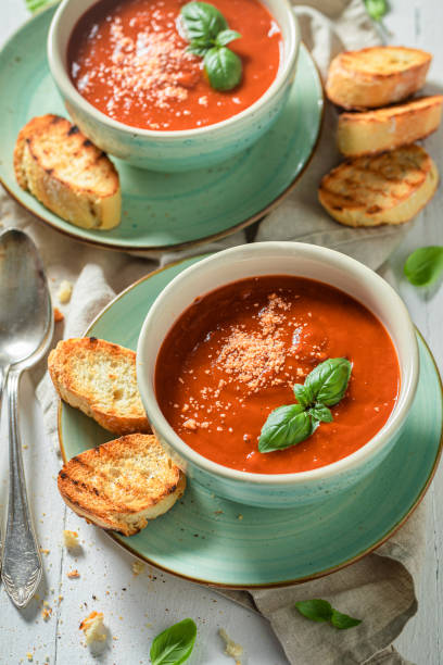 istock Ready to eat creamy tomato soup with basil and toasts 1192453077