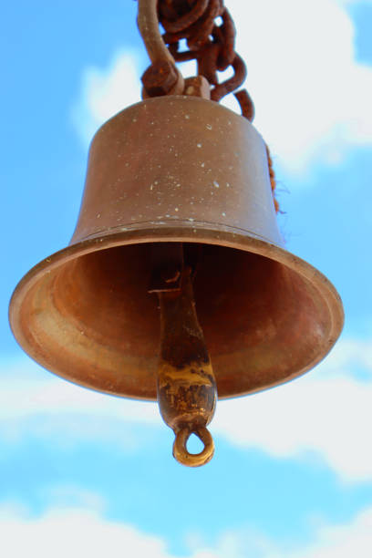 istock Old temple bell on background of blue sky 1192456567