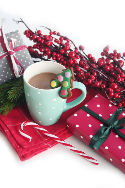 istock Christmas cookie in shape of a Christmas tree on a coffee cup on white 1192459016
