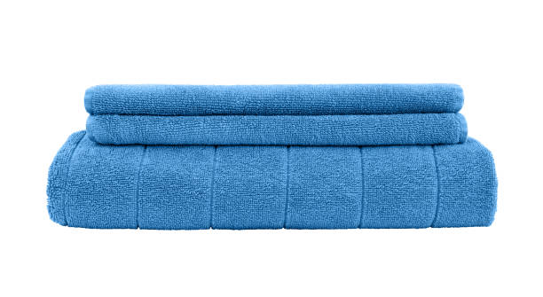 istock Three blue towels isolated over white background. 1192460824
