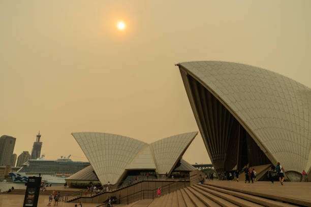 The sky and the sun over the Opera House were covered by heavy red smoke from bushfire, Australia 7-12-2019 stock photo