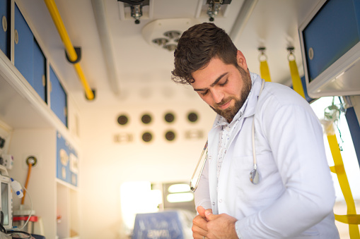 Paramedic in ambulance vehicle