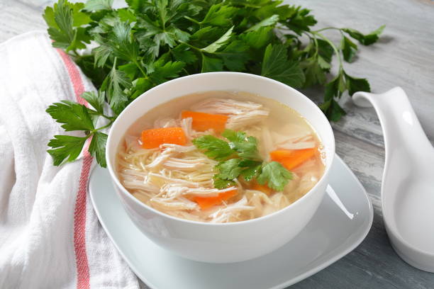 Chicken soup with noodles Chicken soup with noodles and vegetables in bowl. Healthy food concept chicken soup stock pictures, royalty-free photos & images