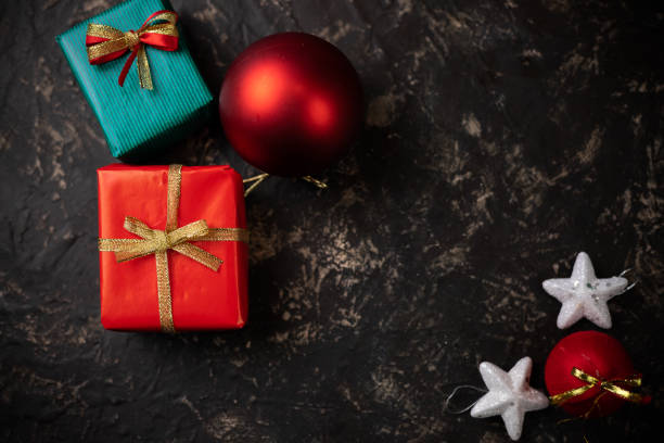 istock Christmas gifts and decorative objects with dark background top view with dark background 1192465988