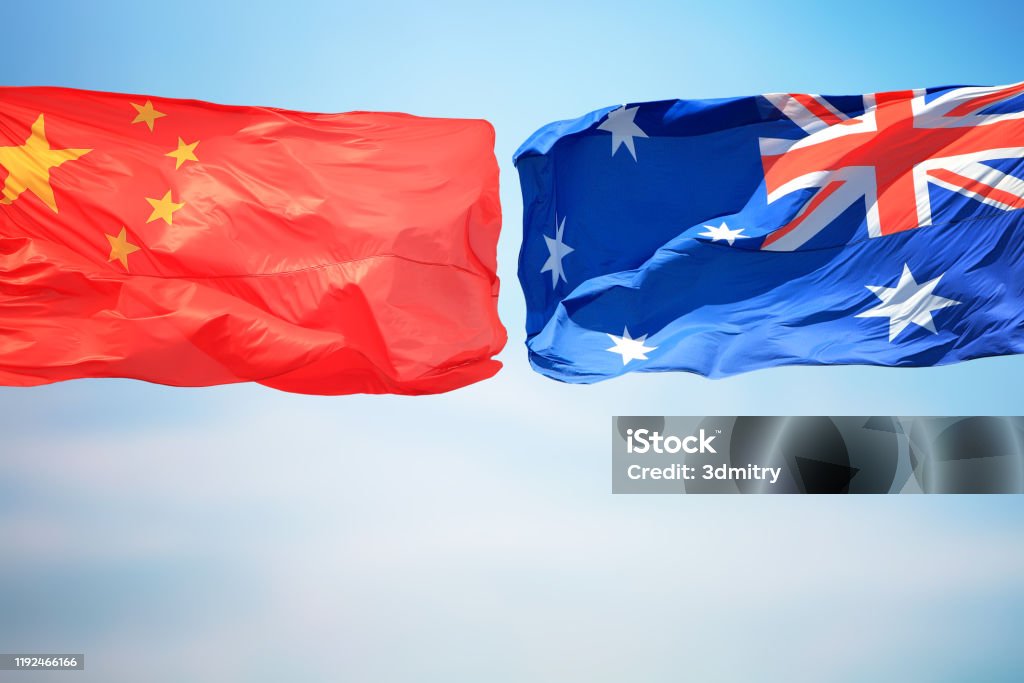Flags of China and Australia Chinese and Australian flags amid blue skies China - East Asia Stock Photo