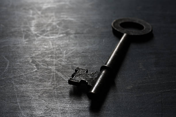 istock Vintage key on wooden background 1192470483