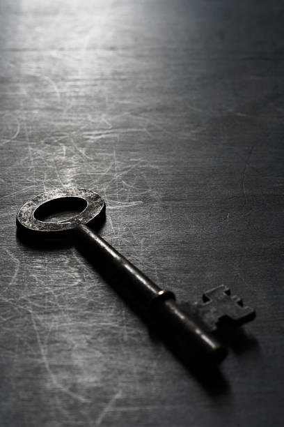 istock Vintage key on wooden background 1192470512