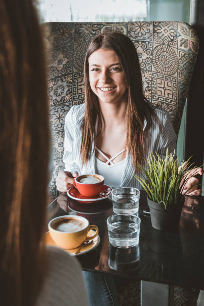 istock Young Female Friends is Having a Coffee Break 1192470545