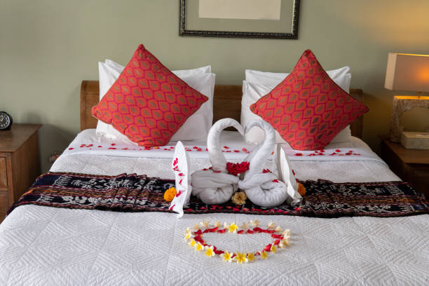istock Two Towel Swans with Flowers 1192471349
