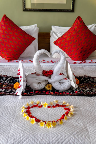 istock Two Towel Swans with Flowers 1192471361