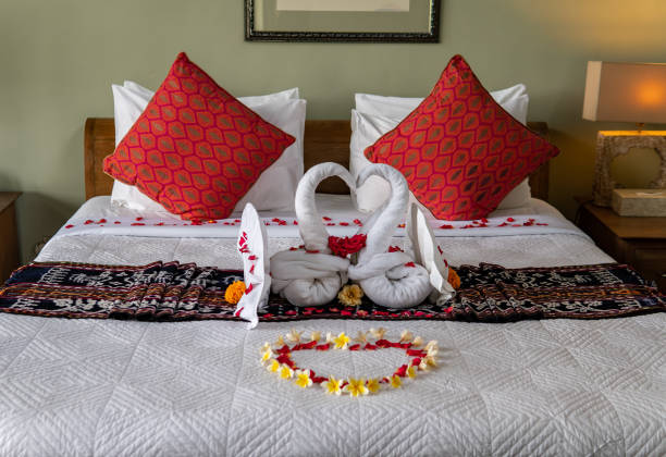 istock Two Towel Swans with Flowers 1192471373